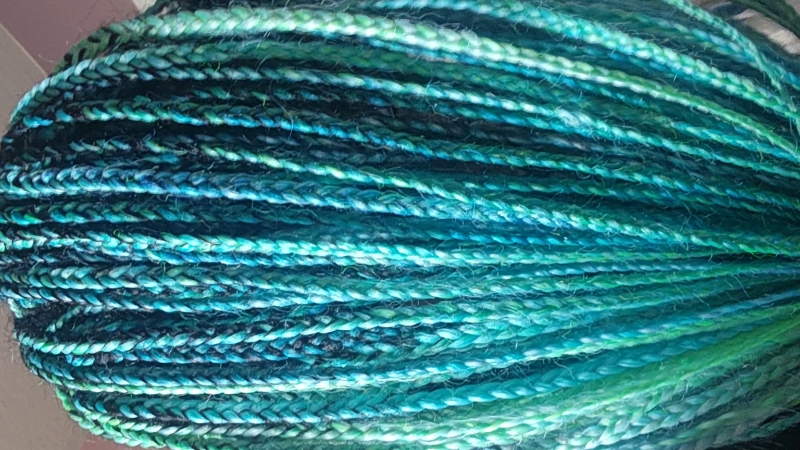 Close-Up of Braided Hair in Various Shades of Blue and Green